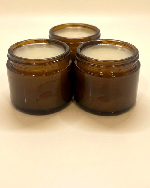 Bee & Bovine poured tallow balm in three amber glass jars