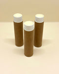Bee & Bovine tallow lip balm in three kraft paper tubes