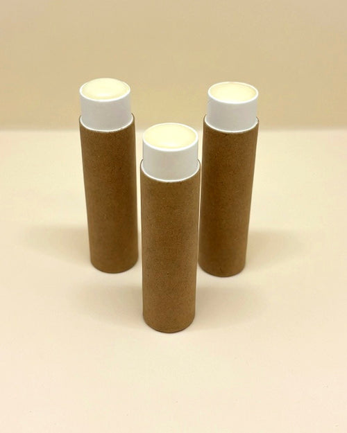 Bee & Bovine tallow lip balm in three kraft paper tubes
